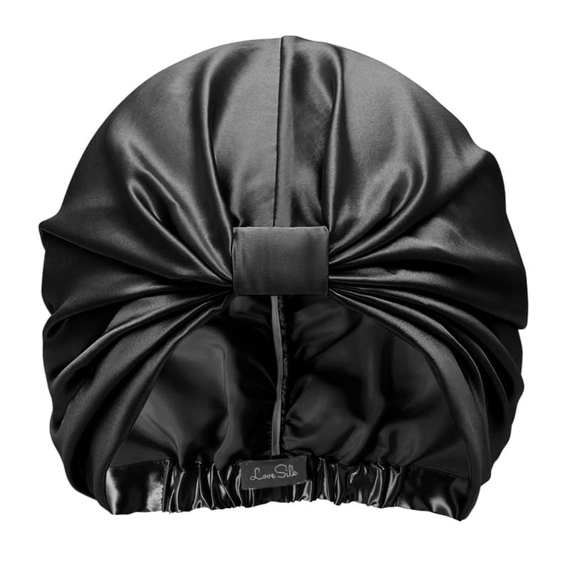 Seidene Schlafmütze mit eleganter Drapierung aus Seidensatin.